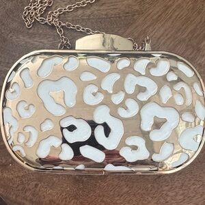 Cache Gold and White Patterned Clutch